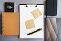 Workplace with paper holder, notepads, sticky notes, pens, glasses and calendar Royalty Free Stock Photo