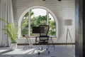 workplace with pc workstation in front of large arched windows landscape view bright sunlight remote work freelance concept