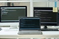 Workplace of programmer with computers with codes Royalty Free Stock Photo