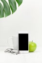 Workplace with smartphone, apple and coffee cup Royalty Free Stock Photo