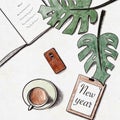 Workplace top view, leaves of monstera, a cup of coffee, phone and notebook, reflection plans for the new year, semantic analysis