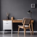 Workplace with white chair at wooden drawer writing desk against of window near dark grey wall Interior of home office Royalty Free Stock Photo