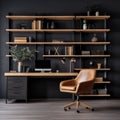 Workplace with wooden desk and black chair against of black wall with shelving unit. Interior of modern Scandinavian home office