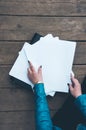 The workplace on the wooden table with documents. Paper in folder