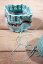 Workshop crochet and knitting, blue cup warmer and yarn