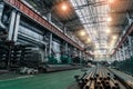 Workshop factory interior with machines, industrial lathes and steel pipes for processing metal production Royalty Free Stock Photo