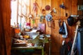 Workshop or garage on a farm in an old wooden barn. A lot of different tools lying around in a mess to repair any equipment Royalty Free Stock Photo