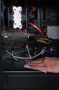 repairman cleans the computer system unit from dust close-up Royalty Free Stock Photo