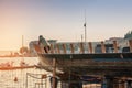 Workshop for restoration of ships on the shores of the Adriatic sea. Man repairs a boat at dawn at sunrise. Royalty Free Stock Photo