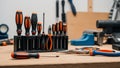 A set of orange and black handled screwdrivers are organized in a black Royalty Free Stock Photo