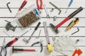 Workshop tools are arranged on wooden boards. Background made of workshop tools.