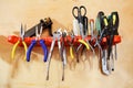 Workshop tools pliers on wall stand. Royalty Free Stock Photo
