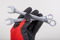 Workshop wrenches held in hand. Hand in a work glove Royalty Free Stock Photo