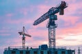 Worksite with cranes, new buildings or houses under construction Royalty Free Stock Photo