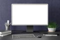 Workspace with blank computer monitor white screen Royalty Free Stock Photo