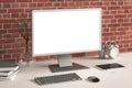 Workspace with blank computer monitor white screen Royalty Free Stock Photo