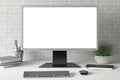 Workspace with blank computer monitor white screen Royalty Free Stock Photo