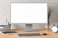 Workspace with blank computer monitor white screen