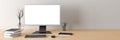 Workspace with blank computer monitor white screen mockup on the wooden desk near white wall Royalty Free Stock Photo