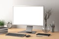 Workspace with blank computer monitor white screen