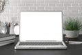 Workspace with blank laptop monitor white screen Royalty Free Stock Photo