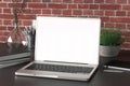 Workspace with blank laptop monitor white screen Royalty Free Stock Photo