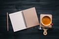 Workspace with blank Note book, pencil and coffee cup on dark wood background.Flat lay, top view office table desk Royalty Free Stock Photo