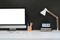 Workspace blank screen desktop computer, Mockup computer, lamp and home office accessories on white desk Royalty Free Stock Photo