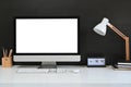 Workspace blank screen desktop computer, Mockup computer, lamp and home office accessories on white desk Royalty Free Stock Photo