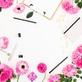 Workspace with clipboard, diary, pink roses and accessories on white background. Flat lay Royalty Free Stock Photo