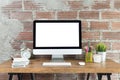 Workspace with computer with blank white screen, and office supplies on wooden desk Royalty Free Stock Photo