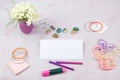 Workspace with computer, bouquet Hydrangeas, clipboard. Women`s fashion accessories isolated on pink background. Flat Royalty Free Stock Photo