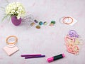 Workspace with computer, bouquet Hydrangeas, clipboard. Women`s fashion accessories isolated on pink background. Flat Royalty Free Stock Photo