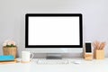 Workspace computer with a white blank screen is putting on a working desk. Royalty Free Stock Photo