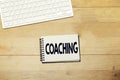 Workspace, desktop : coaching concept on notebook and keyboard Royalty Free Stock Photo