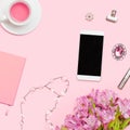 Home office workspace with copyspace. Flat lay, view Beauty blog. Woman fashion accessories, phone on pink background. Royalty Free Stock Photo