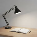 Workspace featuring a black adjustable desk lamp on a light wood Royalty Free Stock Photo