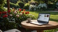 Workspace with Garden Table, Laptop, Coffee Cup Royalty Free Stock Photo
