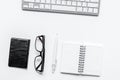 Workspace with glasses and notebook office desk white background top view mock up Royalty Free Stock Photo