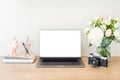 Workspace laptop computer with blank white screen and office supplies on office workplace. Feminine desk table with laptop, Royalty Free Stock Photo