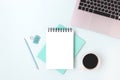 Workspace with laptop, mug of coffee coffee and notebook mockup. Royalty Free Stock Photo