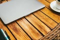 Top view of the workspace with a laptop, on a brown wooden table with a smartphone a cup of coffee. business concept. Remote work Royalty Free Stock Photo