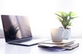 Workspace ,laptop on white table with coffee cup and notebook