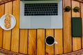 Workspace minimalistic concept with gray modern laptop and smartphone. Time for a coffee break Royalty Free Stock Photo