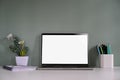 Workspace mockup laptop, pencil, notebook and cactus on desk. Royalty Free Stock Photo