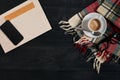 Workspace with newspaper, coffee cup, scarf, glasses. Stylish office desk. Autumn or Winter concept. Flat lay, top view Royalty Free Stock Photo