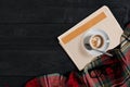 Workspace with newspaper, coffee cup, scarf, glasses. Stylish office desk. Autumn or Winter concept. Flat lay, top view Royalty Free Stock Photo