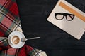 Workspace with newspaper, coffee cup, scarf, glasses. Stylish office desk. Autumn or Winter concept. Flat lay, top view Royalty Free Stock Photo