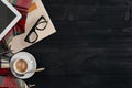 Workspace with newspaper, coffee cup, scarf, glasses. Stylish office desk. Autumn or Winter concept. Flat lay, top view Royalty Free Stock Photo