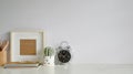 Workspace notebook, photo frame, cactus plant. Royalty Free Stock Photo